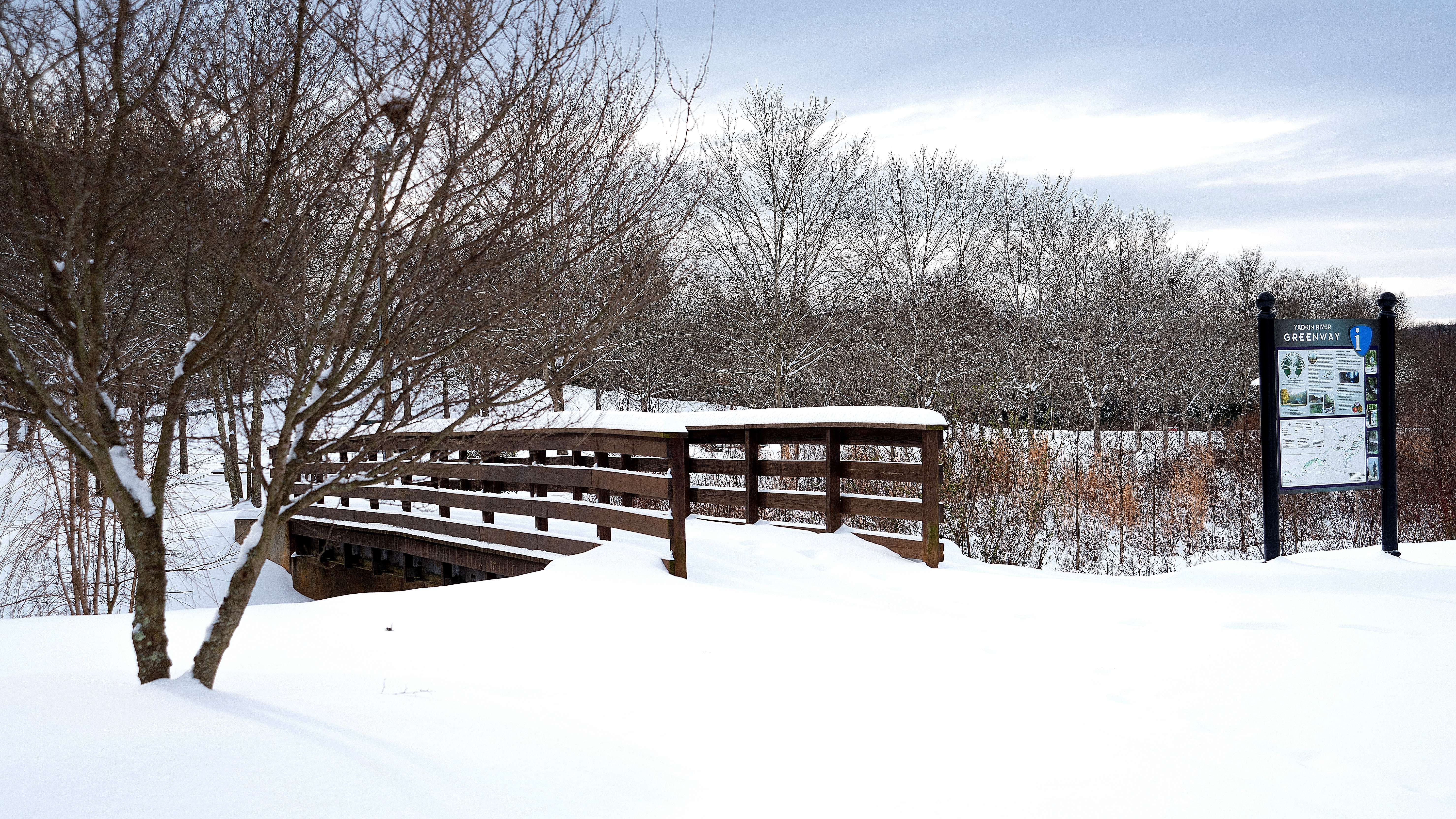 Snow Covered Bridge Over Greenway