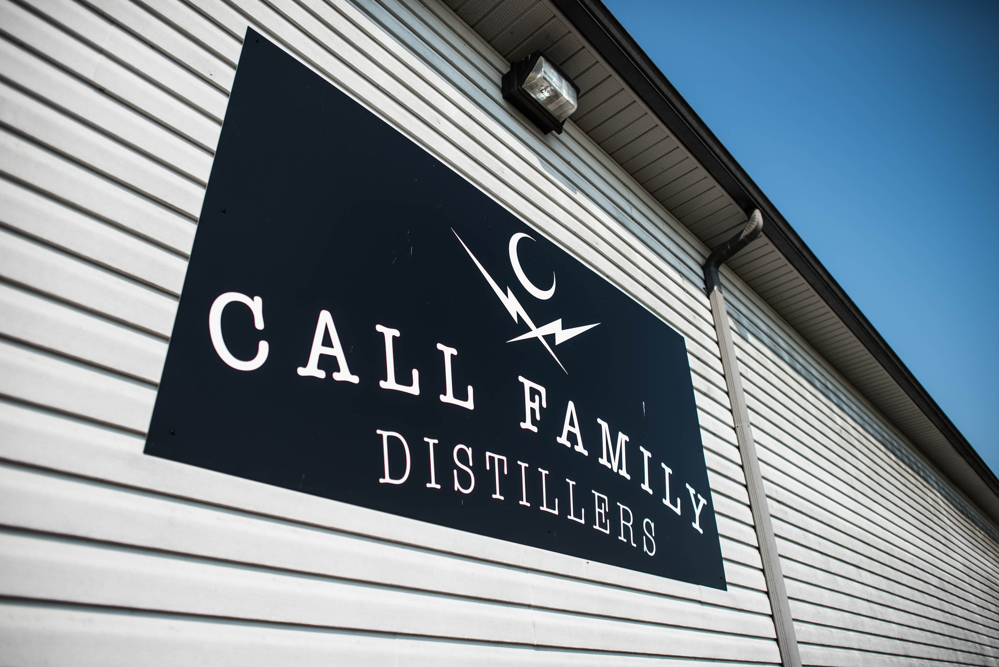 Call Family Distillers Sign